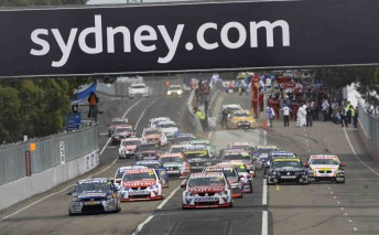 The V8 Supercars pack roars towards turn one at the Sydney Telstra 500
