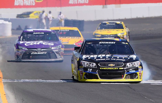 Stewart beats Hamlin to the line after their collision