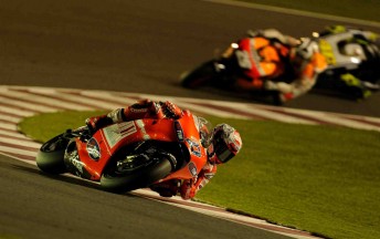 Ducati rider Casey Stoner leads a Honda at Qatar