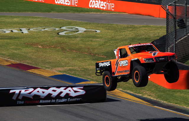 Robby Gordon attacking the first jump on pit straight