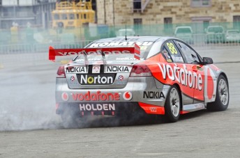 Craig Lowndes launched the car by performing a spectacular burnout