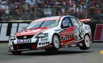 Garth Tander leaps over the turn one kerb on his way to pole position today