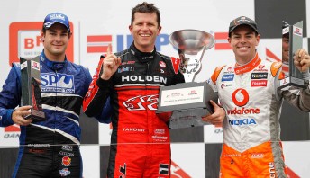 Garth Tander (centre) on the podium with Shane van Gisbergen (left) and Craig Lowndes (right) at Albert Park