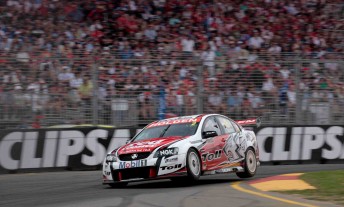 2010 Clipsal 500 winner Garth Tander blasts through the first chicane in front of a packed grandstand