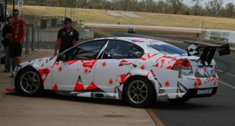 The stickers placed in appropriate positions around the TeamVodafone Holden disguises the Commodore