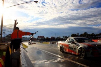 Gary MacDonald crosses the line to win at Bathurst in 2009