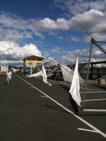 Large portable marquees behind the pit stalls were blown over today