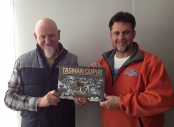 Tony Loxley (right) with business partner Jeff Hosnell and their Tasman Cup book