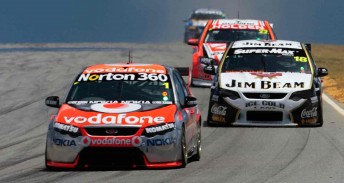 Jamie Whincup in his T8-built Falcon leads James Courtney in his T8-built Jim Beam Racing Falcon