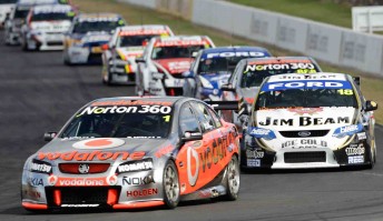 Jamie Whincup leads James Courtney at Queensland Raceway