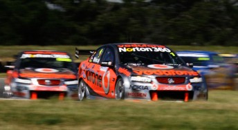 Jamie Whincup leads Craig Lowndes at Symmons Plains