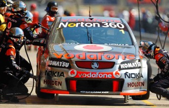 TeamVodafone affect a pitstop on Jamie Whincup