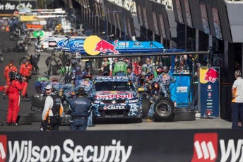 The Red Bull team service the #1 Holden