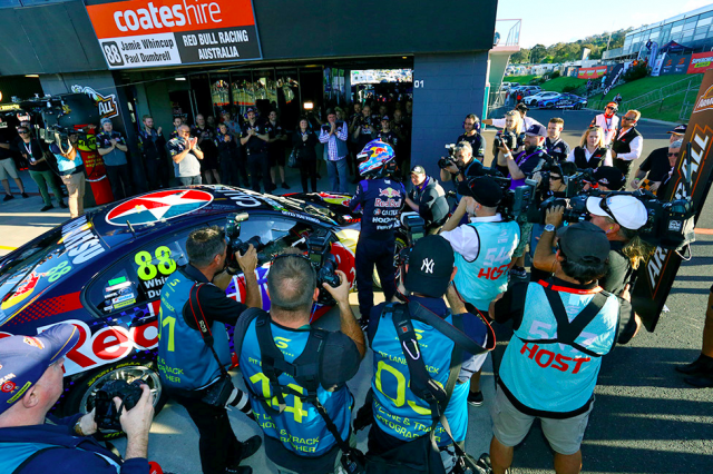 Photographers swarm around pole sitter Whincup