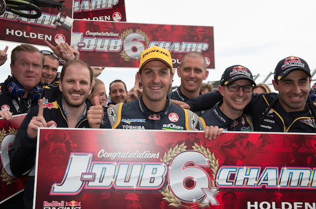 Jamie Whincup celebrates victory with the Red Bull team