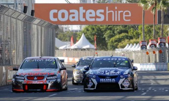 Jamie Whincup and Shane van Gisbergen start the last lap side-by-side