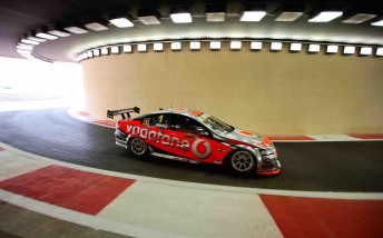 Jamie Whincup drives through the pit lane tunnel at the stunning Yas Marina Circuit