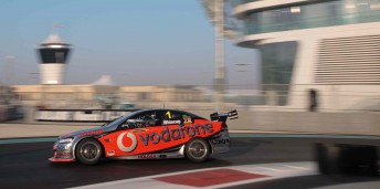 Jamie Whincup pedals his TeamVodafone Commodore around one of the controversial tyre bundles in practice at Yas Marina yesterday