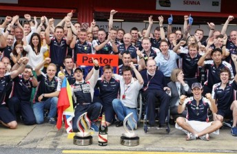 The Williams team celebrate victory prior to the outbreak of the fire