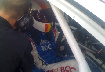 Tom Williamson gets strapped into the Team BOC Commodore VE