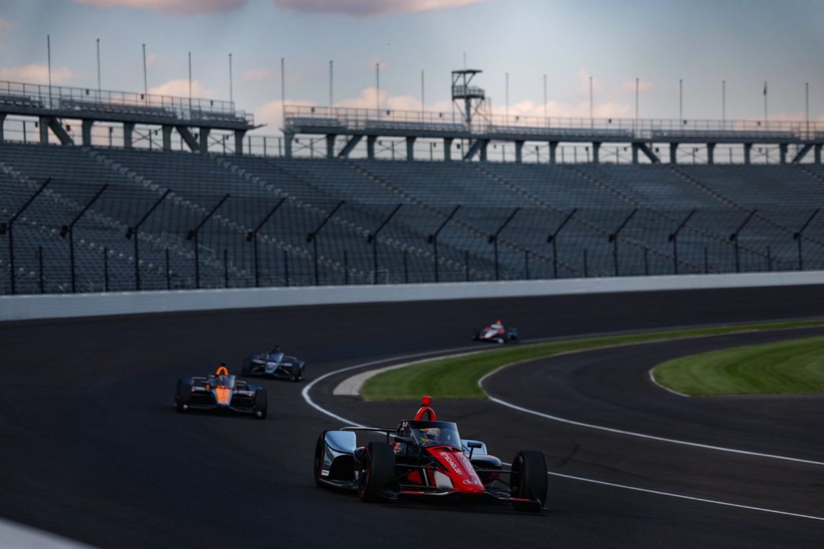 Alex Palou leads a group of cars during the initial hybrid engine component test at the Indianapolis Motor Speedway in October, 2023.