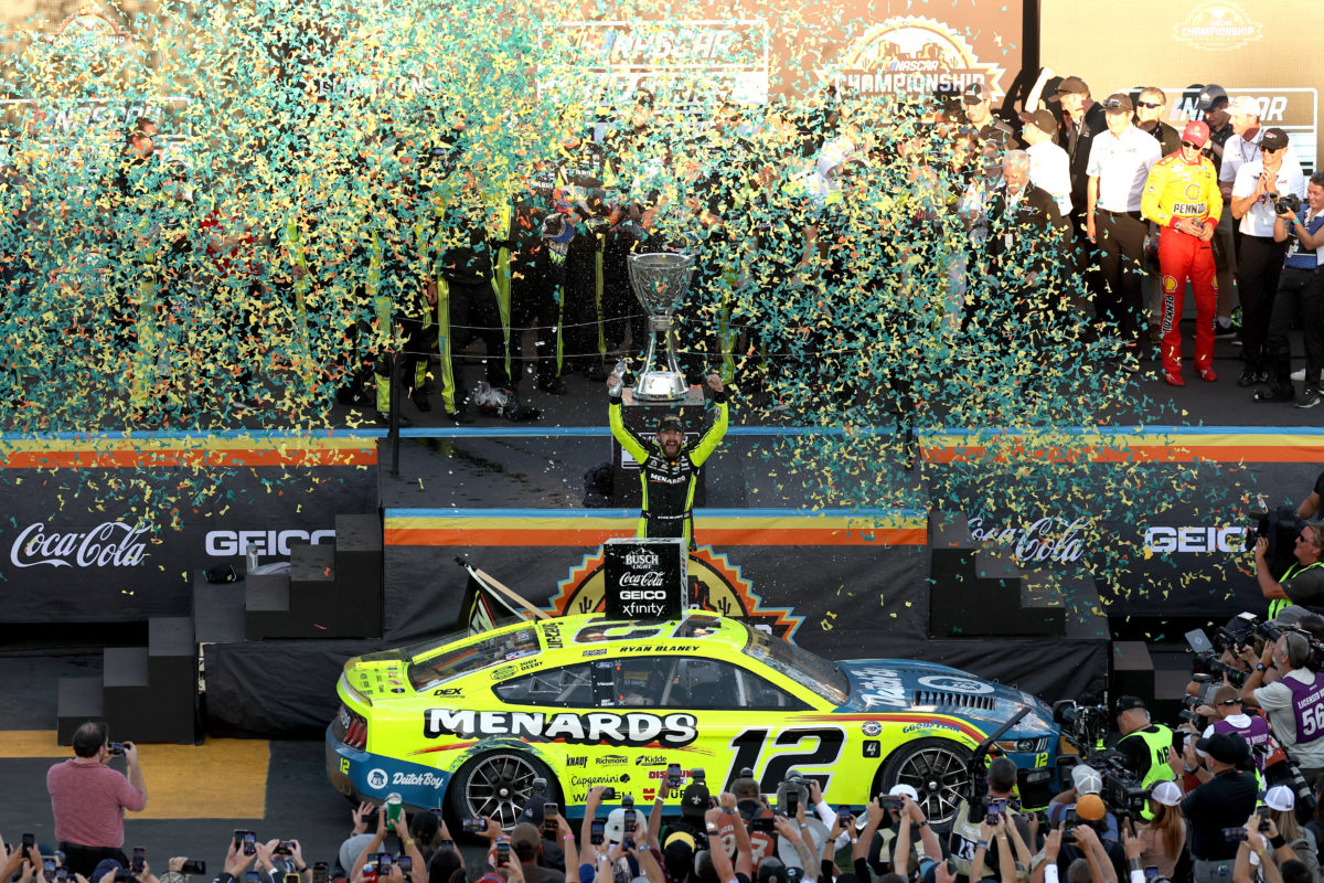 AVONDALE, ARIZONA - NOVEMBER 05: Ryan Blaney, driver of the #12 Menards/Dutch Boy Ford, celebrates in victory lane after winning the 2023 NASCAR Cup Series Championship, finishing first of the Championship 4 drivers in the NASCAR Cup Series Championship race at Phoenix Raceway on November 05, 2023 in Avondale, Arizona. (Photo by Christian Petersen/Getty Images)