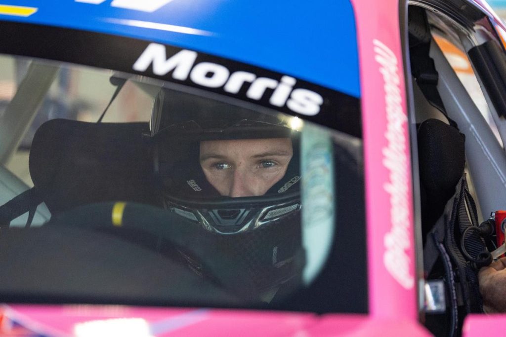 Nash Morris sits in a Porsche during a Porsche Michelin Sprint Challenge round in 2023