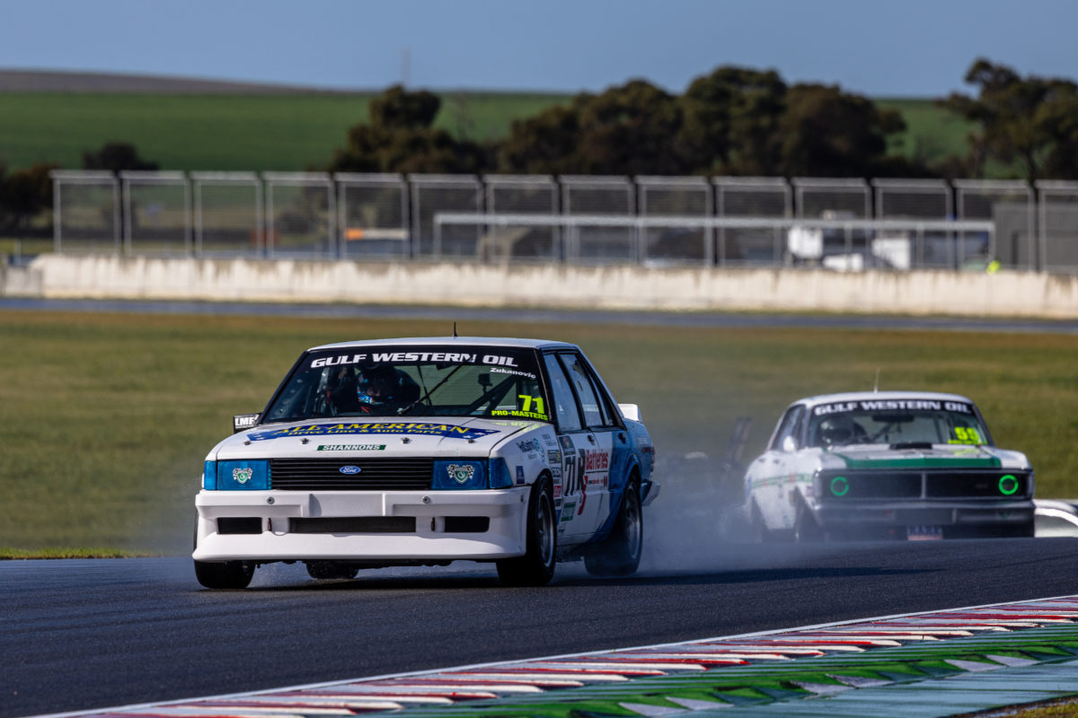 Touring Car Masters cars in wet conditions at The Bend Motorsport Park